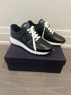 Prada Black Leather Low-Top Sneakers with White Laces and Soles